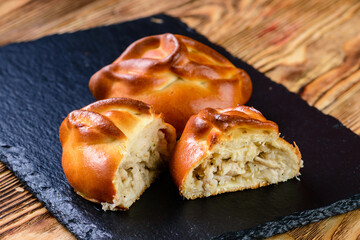 Canvas Print - russian homemade hearty pies with different fillings. Homemade baking. Traditional Russian and Ukrainian cuisine.