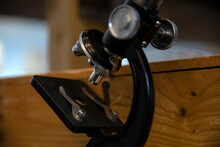 Close-up Of Microscope On Wooden Table