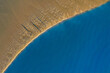 © AmazingAerialAgency - Aerial view of fishermen fishing on the shore of the river