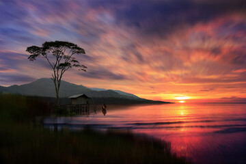 Wall Mural - small house at sunset over the river