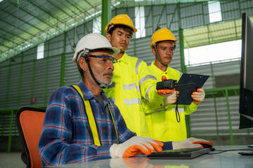 Aufkleber - Engineer working at factory,Engineers in hard hats discuss new project while using laptop.