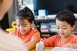 © MIA Studio - Happy family lockdown activity at home.Asian Mother and children are learning bible sunday school study online for bible story.Mom woman teaches her child.Sibling kids learning at home during covid19.