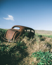 Rusted Car On Grass
