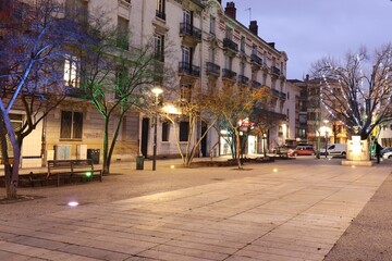 Wall Mural - La place Jean Moulin illuminée le soir, ville de Saint Etienne, département de la Loire, France