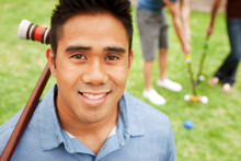 Smiling Man Holding Croquet Mallet