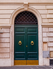 Wall Mural - vintage residential building entrance arched green door, Rome Italy