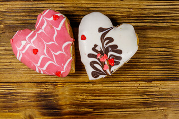 Wall Mural - Heart shaped cookies on wooden table. Top view, copy space. Dessert for valentine day