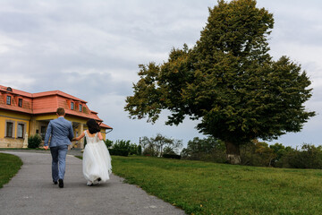 Canvas Print - Brides walk on their wedding day, couple walk on their festive and touching day.