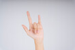 © THESHOTS.CO - I love you hand sign isolate over white background.