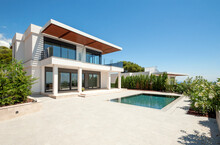 The Modern Facade Of A Luxury Villa With A Large Swimming Pool. Luxury MODERN Property.