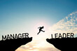 Silhouette Man jumping from Manager cliff to leader cliff on cloud and blue sky. Change behaviour and mindset to Leadership concept