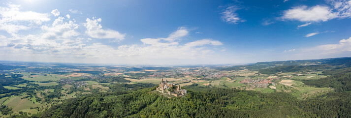 Wall Mural - Panoramic aerial view of Hohenzollern hill with castle at summer noon near Stuttgart in Germany