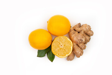 Wall Mural - Isolated pieces of ginger and lemon. Natural medicine, anti-influenza and antiviral ingredients on a white background.