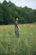 © SHOTPRIME STUDIO - Woman portrait on nature Walk in the field against the background of trees