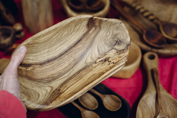 Fair folk art, carpentry workshop, handmade wooden products. set of dishes, carpenter's work, wood carving art