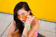 © Antonio Ovejero Diaz/Westend61 - Portrait of beautiful girl wearing sunglasses sitting on longboard