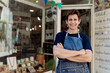 © Ezequiel Gimenez/Westend61 - Happy small business owner standing with arms crossed outside her store