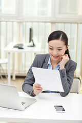 Portrait of a Business woman holding fiels