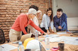 © Dragana Gordic - Business People Working in The Office. Happy colleagues laughing in the office meeting. Shot of a group of businesspeople having a meeting in a modern office.