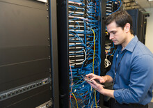 Technician Inspecting Network Server