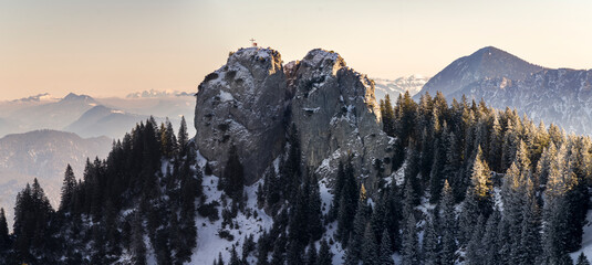 Wall Mural - 2 hikers at sunset at summit of beautiful ettal mountain in the alps