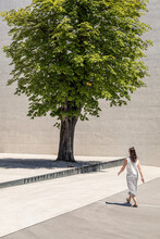 Slovenia, Ljubljana, Monument To The Victims Of All Wars¬†(Spomenik¬†rtvam¬†vseh¬†vojn), Woman Walking Near Tree On Town Square