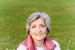 © Katharina und Ekaterina/Westend61 - Smiling mature woman at public park on sunny day