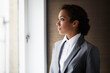 © Connect Images - Portrait of businesswoman looking out of window