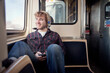 © Connect Images - Young man on train in Chicago, Illinois