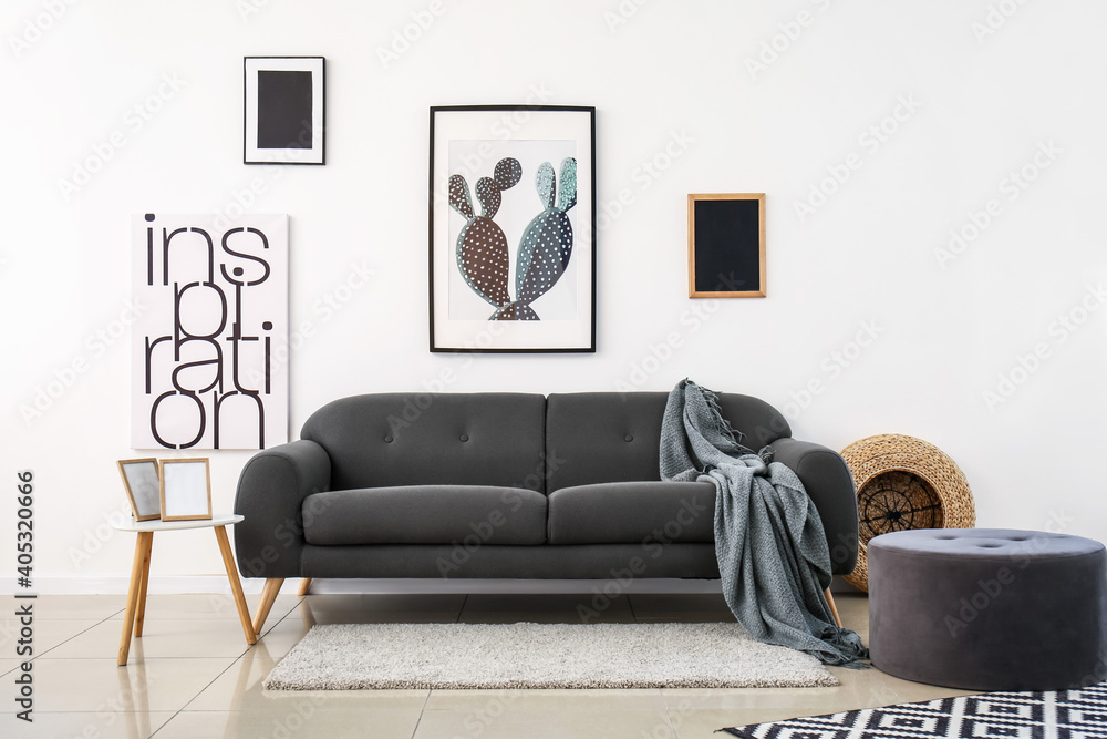 Stylish sofa in interior of living room