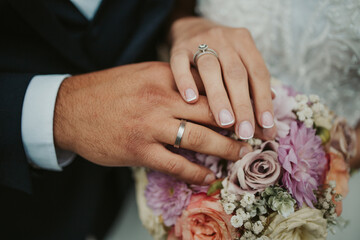 Sticker - Beautiful shot of the hands of a bride and groom showing their rings - wedding, anniversary