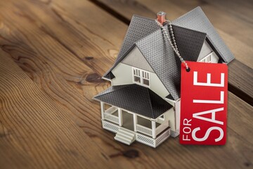 Canvas Print - Classic house model with sale label on the desk