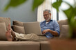 © IndiaPix - A SENIOR ADULT MAN HAPPILY USING LAPTOP