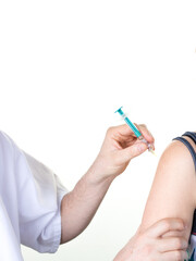 Wall Mural - Hands of doctor vaccinating young woman in clinic injection to female patient