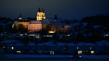 Wall Mural - cars passing by the monastery of st.florian in upper austria on a winter evening