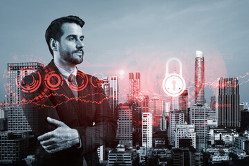 A young European cybersecurity developer in cross hand pose thinking about new concepts at security compliance division to protect clients information. IT lock icons over Bangkok background.