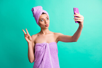 Wall Mural - Photo of beautiful lady hold telephone making selfie showing v-sign blow kiss wear turban isolated teal color background