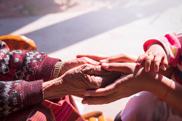 The daughter consoled, the old mother held close hands, strong connections, empathy and compassion, support during a difficult life, near sharing ideas about heart pain.