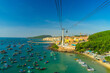 The longest cable car situated on the Phu Quoc Island in South Vietnam and below is traditional fishermen boats lined in the harbor of Duong Dong town in the popular Hon Thom island