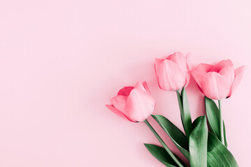 Wall Mural - Beautiful composition spring flowers. Bouquet of pink tulips flowers on pastel pink background. Valentine's Day, Easter, Birthday, Happy Women's Day, Mother's Day. Flat lay, top view, copy space