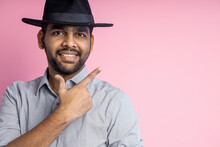 Portrait Of Handsome Indian Guy Standing On Pink Background