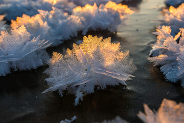 bright yellow beautiful sunrise over a frozen lake