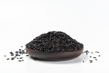 Wall Mural - bowl of black rice on white background