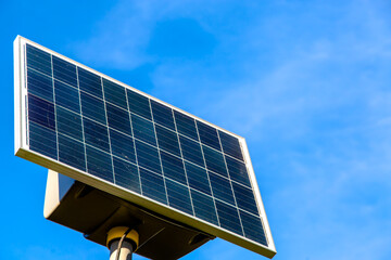 Solar battery on blue sky background