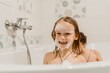 © Marinesea - Little girl wtih her face covered with bubbles having fun in bathtub