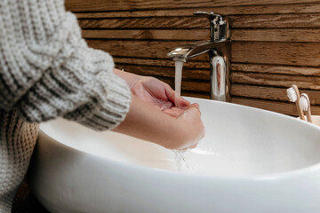 Poster - Closeup shot of a person washing their hand