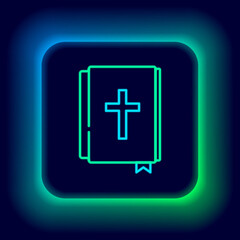 Glowing neon line Holy bible book icon isolated on black background. Colorful outline concept. Vector.