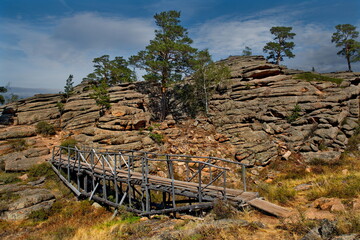 Canvas Print - East Kazakhstan. Tourist trail to the top of the ancient remains in the Bayanaul Nature Park, where the famous Konyr Aulie cave is located.