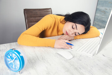 sleeping woman in working table