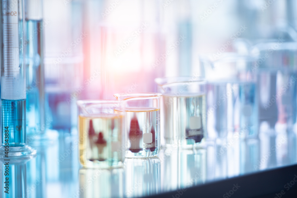 Close-up Of Liquid In Beakers On Table At Laboratory - obrazy, fototapety, plakaty 